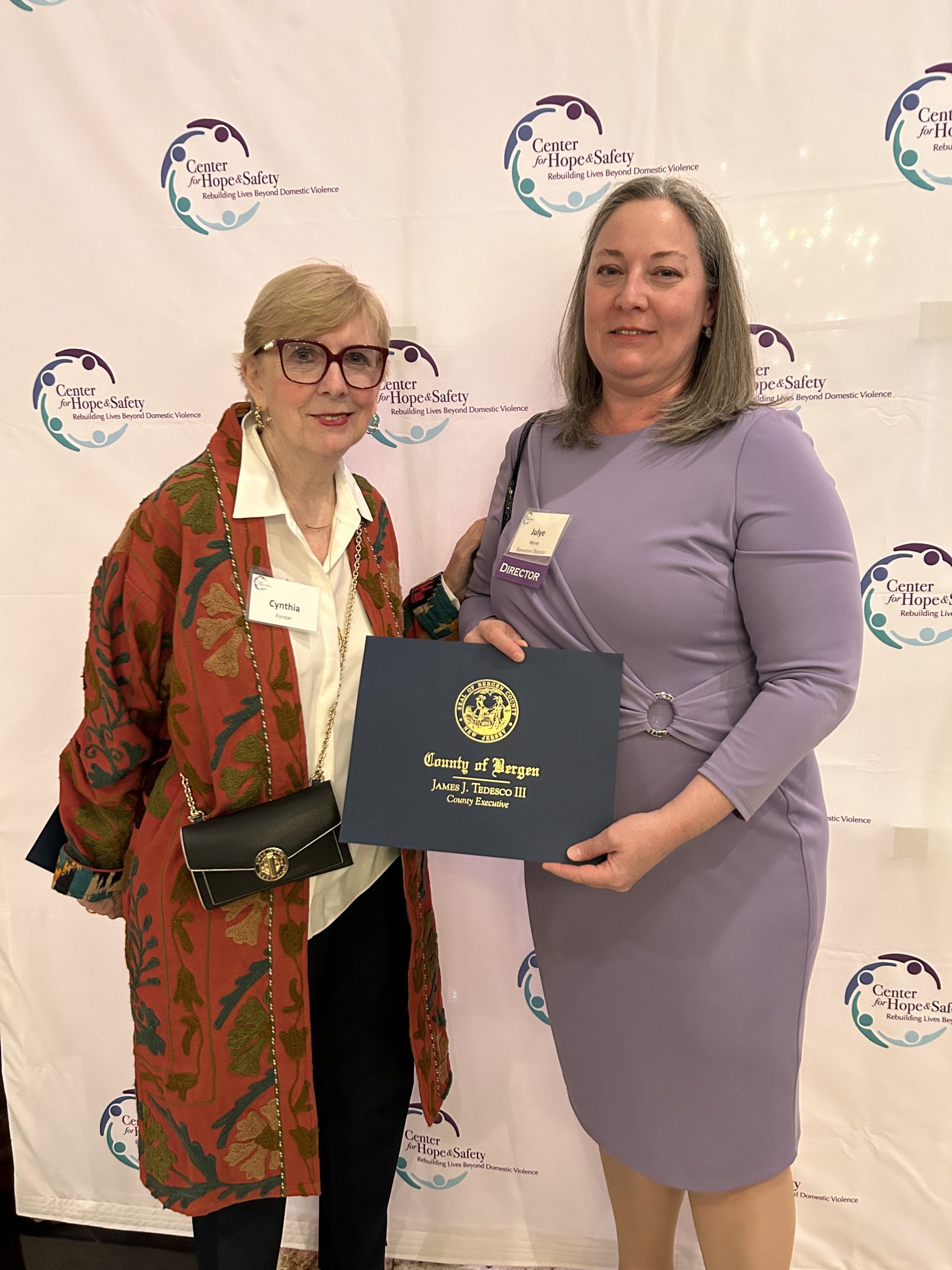 Cynthia Forster presenting CHS Executive Director with Certificate of Commendation from Bergen County Executive Jim Tedesco's office