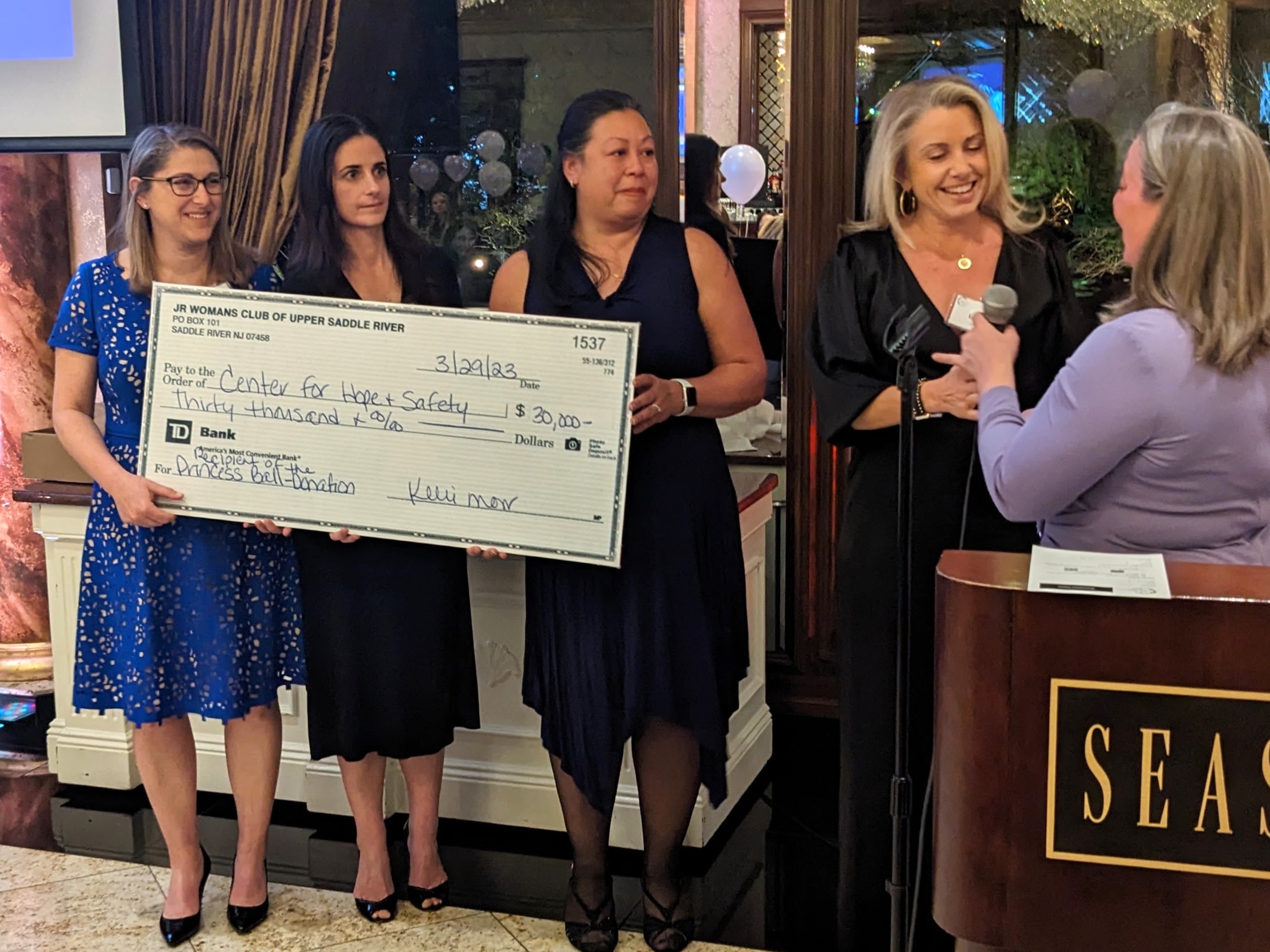 Junior Womans Club of Upper Saddle River presents CHS with check