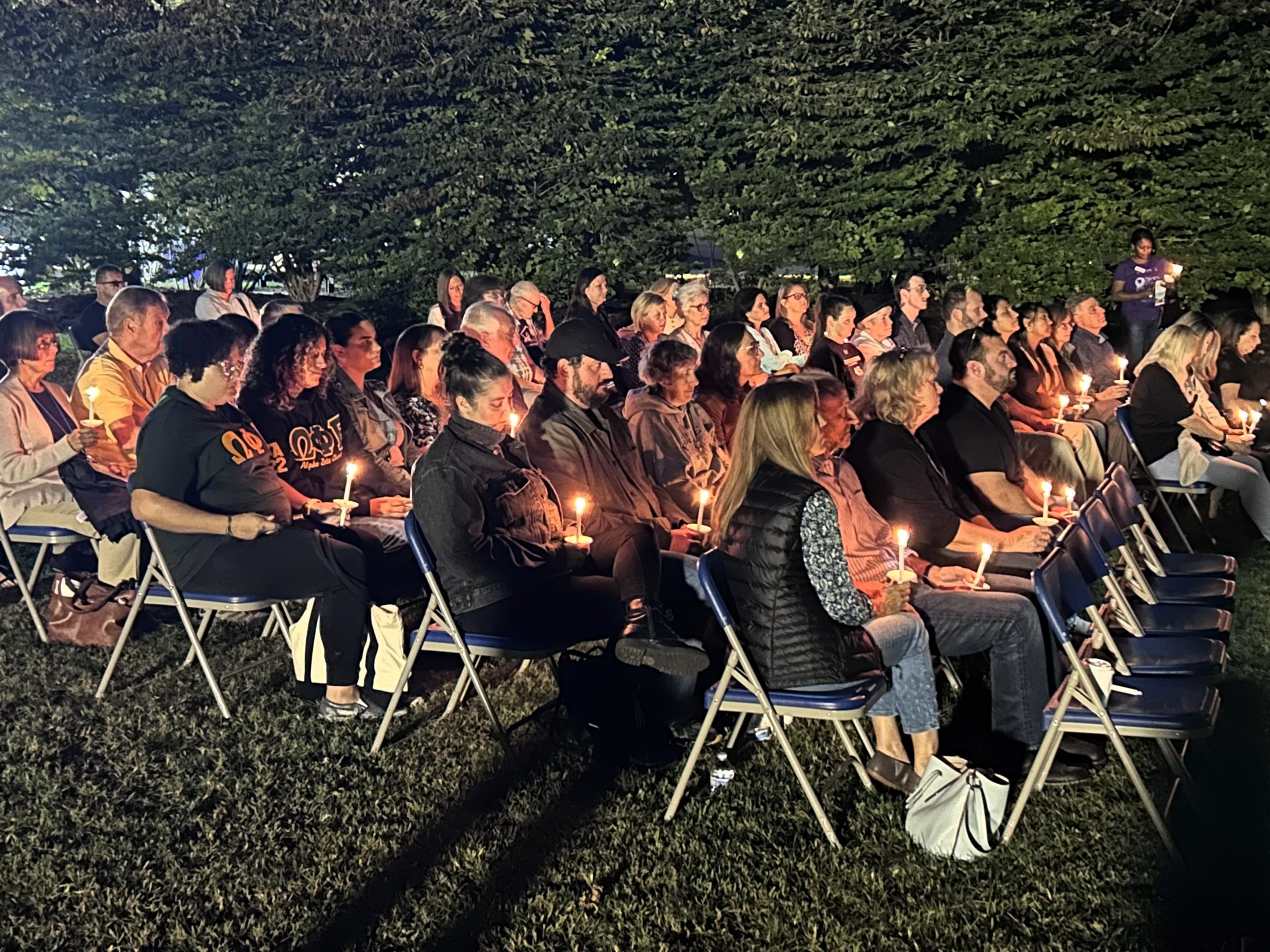 Attendees holding candles at 2023 Vigil