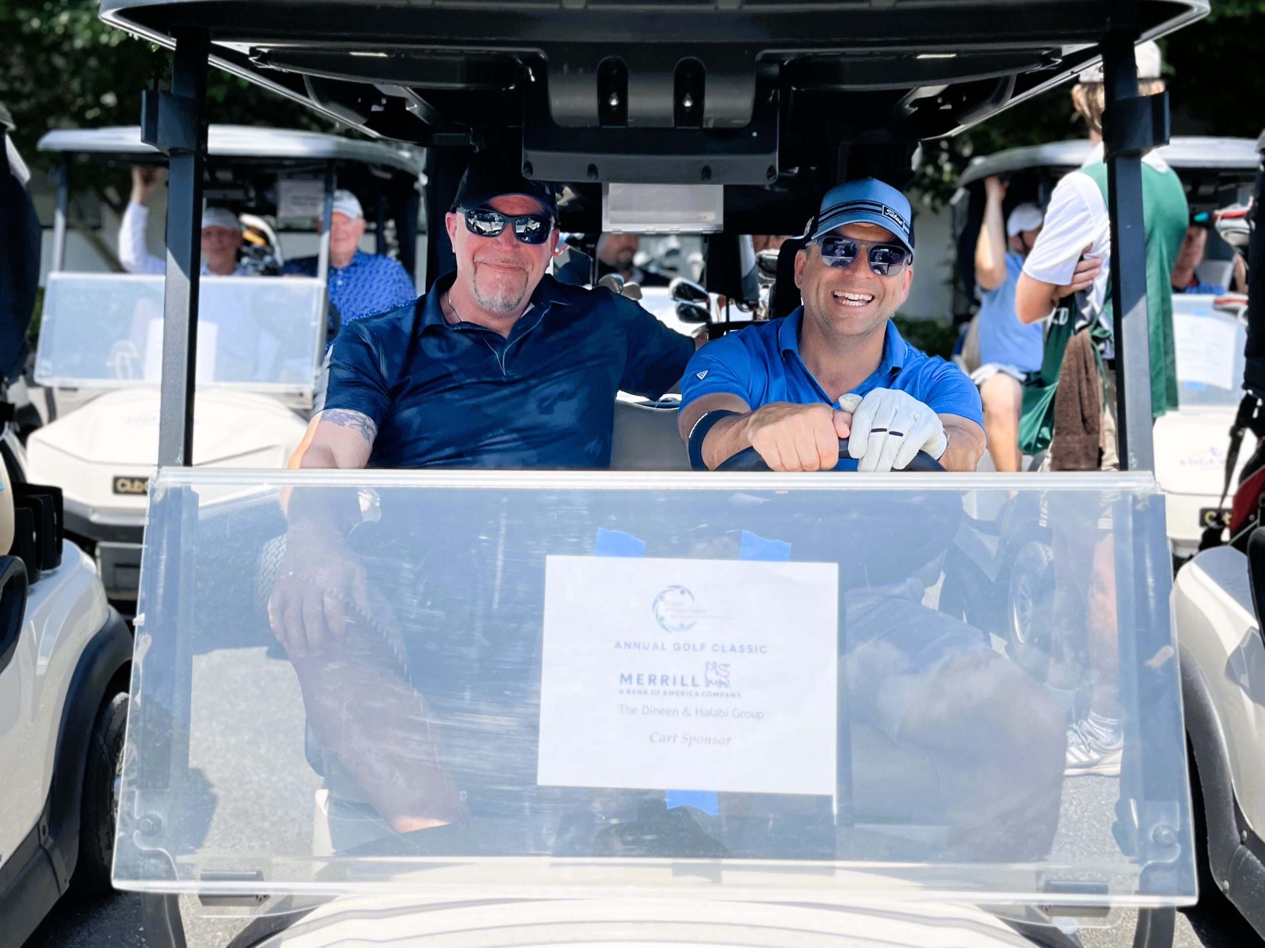 golf attendees in golf cart