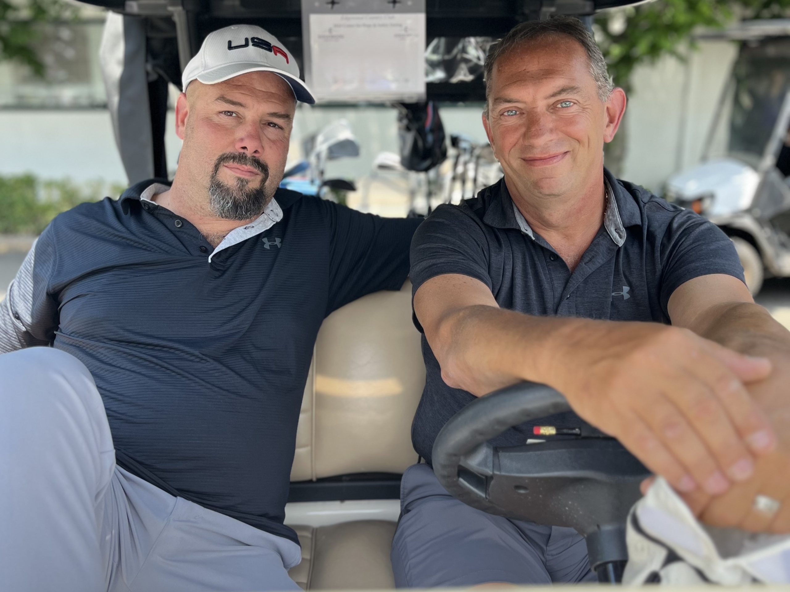golf attendees in golf cart